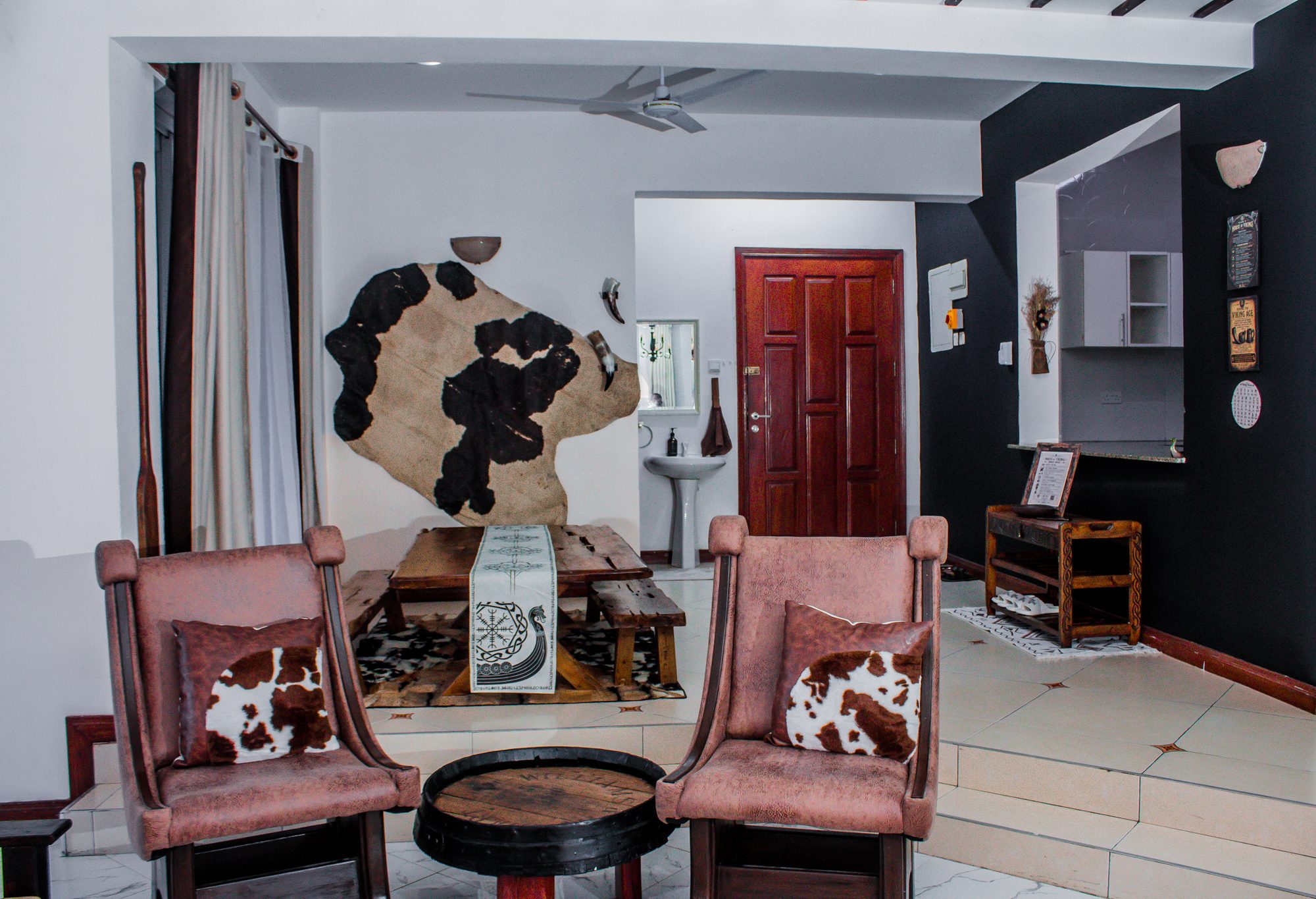 The Hall · cowhide lounge chairs